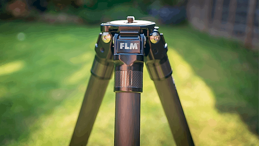 FLM tripod with three legs set on green grass